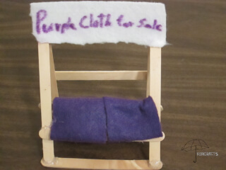 purple cloth on a stand cloth stand
