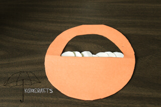 paper basket with white circles a basket of manna
