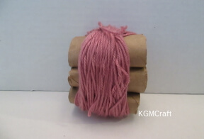 with a piece of yarn tie the loops