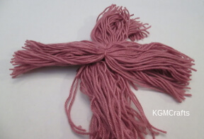 tie the two pompom together