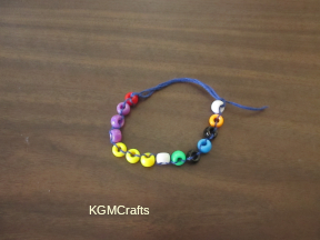 knot it through the white bead