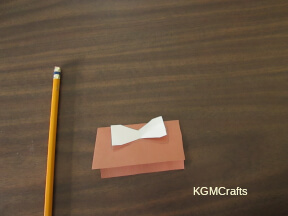 place the manger piece on a folded piece of paper