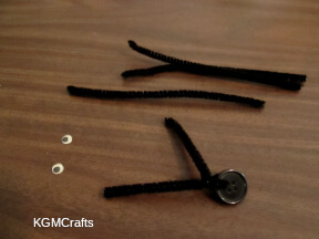 add the pipe cleaners to the button holes