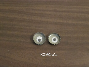add wiggly eyes to the bottle caps
