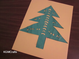 Christmas tree decorated with cut out pieces