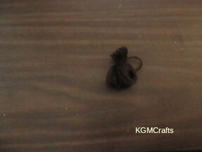 step 2 wrap the yarn near one end