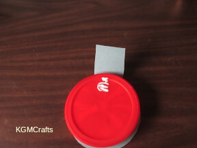 step 6 glue the tab to the back of the lid