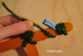 step 5 wrap a pipe cleaner around the flower and stick