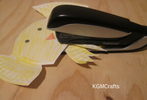 step 4 Staple the legs to the chick