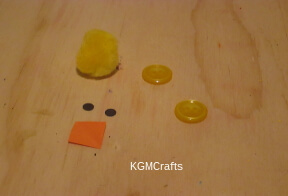 pompom chick step 1 to make the chick cut out eyes and a beak