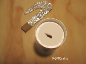 make a hole in the cup