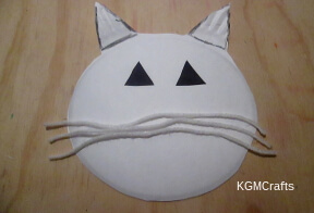 step 2 add eyes and whiskers