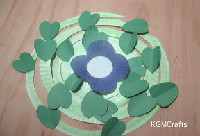 step 5 glue the leaves and flower to the spirals