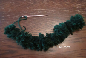 step 3 sew the pompoms together