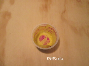 glue the tissue to the cup