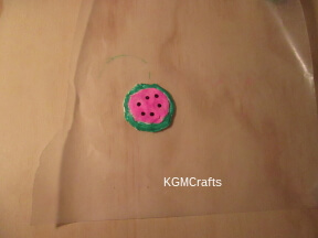 place pink circle in larger one add beads