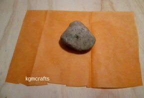 cover the rock with orange tissue