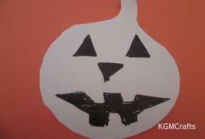 pumpkin rubbing step 3 glue eyes, nose, and mouth on pumpkin