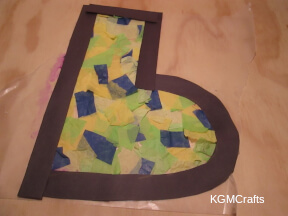 glue the strips to the boot and trim the wax paper