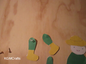 use pushpins to make holes for your brads