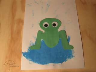 frog in a puddle of water