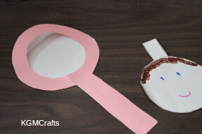 glue the mirror pieces together draw the face on the small circle