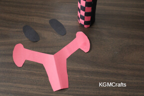 cut the shape out and make black ovals