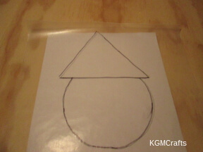draw Santa's head and hat on wax paper