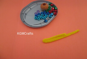 scarecrow doll step 1 count out the bead and bend the pipe cleaner