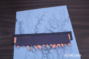 layer the three pieces of paper together