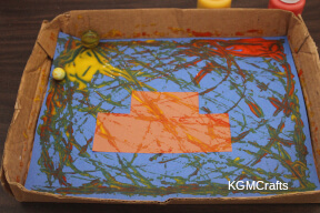 add the marbles and tip the box