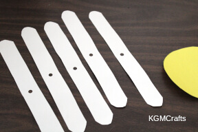 round the ends of the rectangles and add a hole in the center