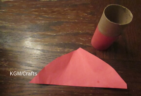 cut paper for hat and to cover cardboard tube.