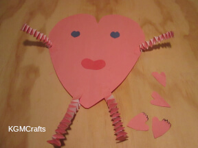 step 4 glue the arms and legs to the large heart.