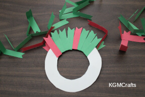 step 2 add the paper to the wreath