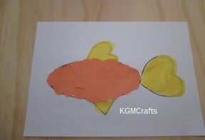cut circles from construction paper and glue to fish