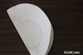 fold the plate in half and draw the shape