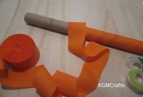 wrap cardboard roll with orange streamer