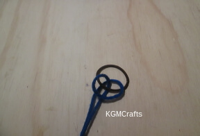 bookmark step 1 add yarn to ponytail holder